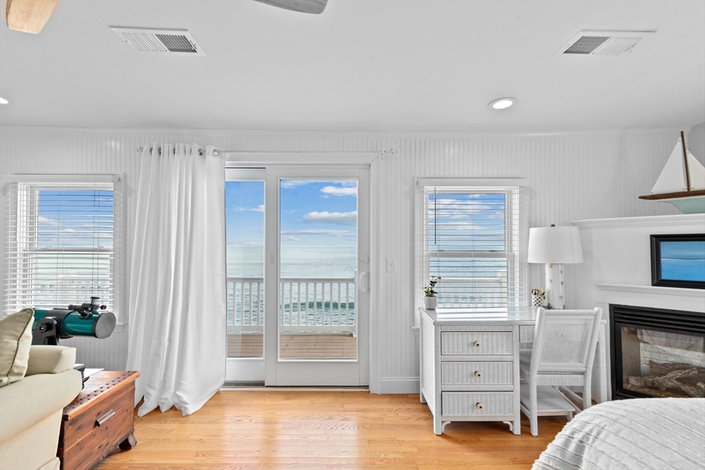 79 Surfside Road Scituate, MA 02066 - Photo 23 of 42 a view of a bedroom with furniture and windows