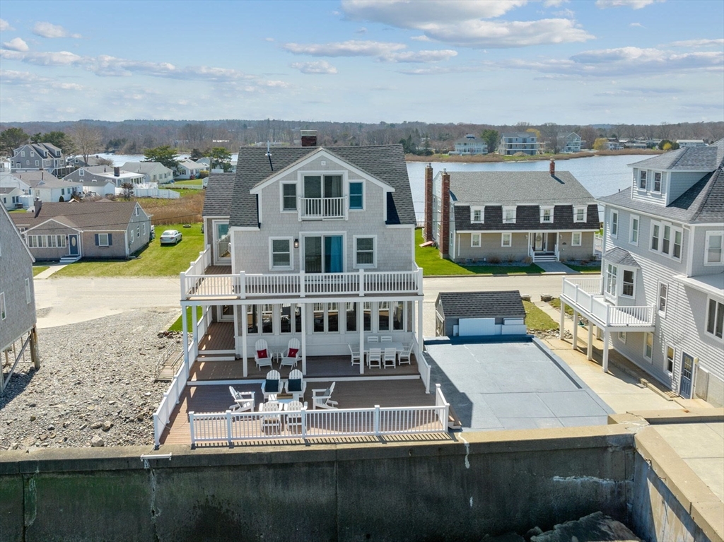 79 Surfside Road Scituate, MA 02066 - Photo 3 of 42 a view of a city with tall buildings