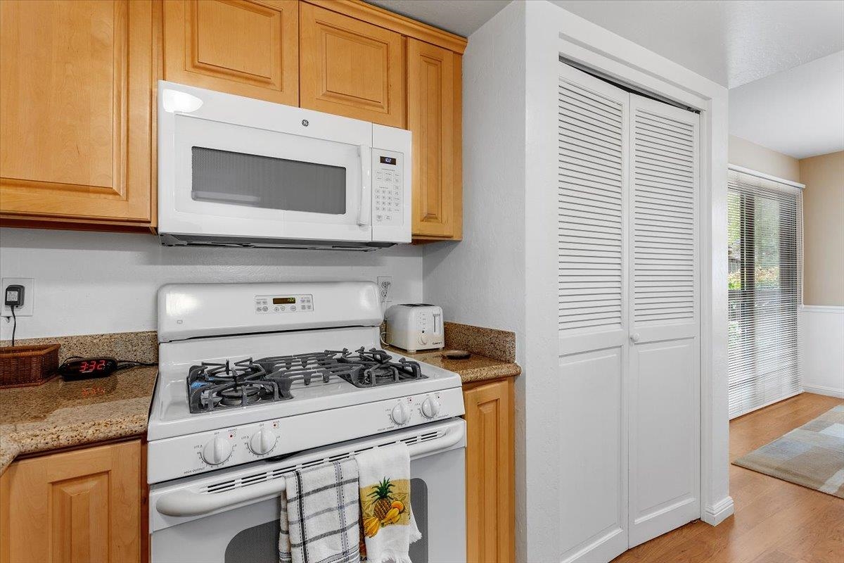 19100 Crest Avenue, Unit 15 Castro Valley, CA 94546 - Photo 14 of 33 a kitchen with a stove microwave and sink