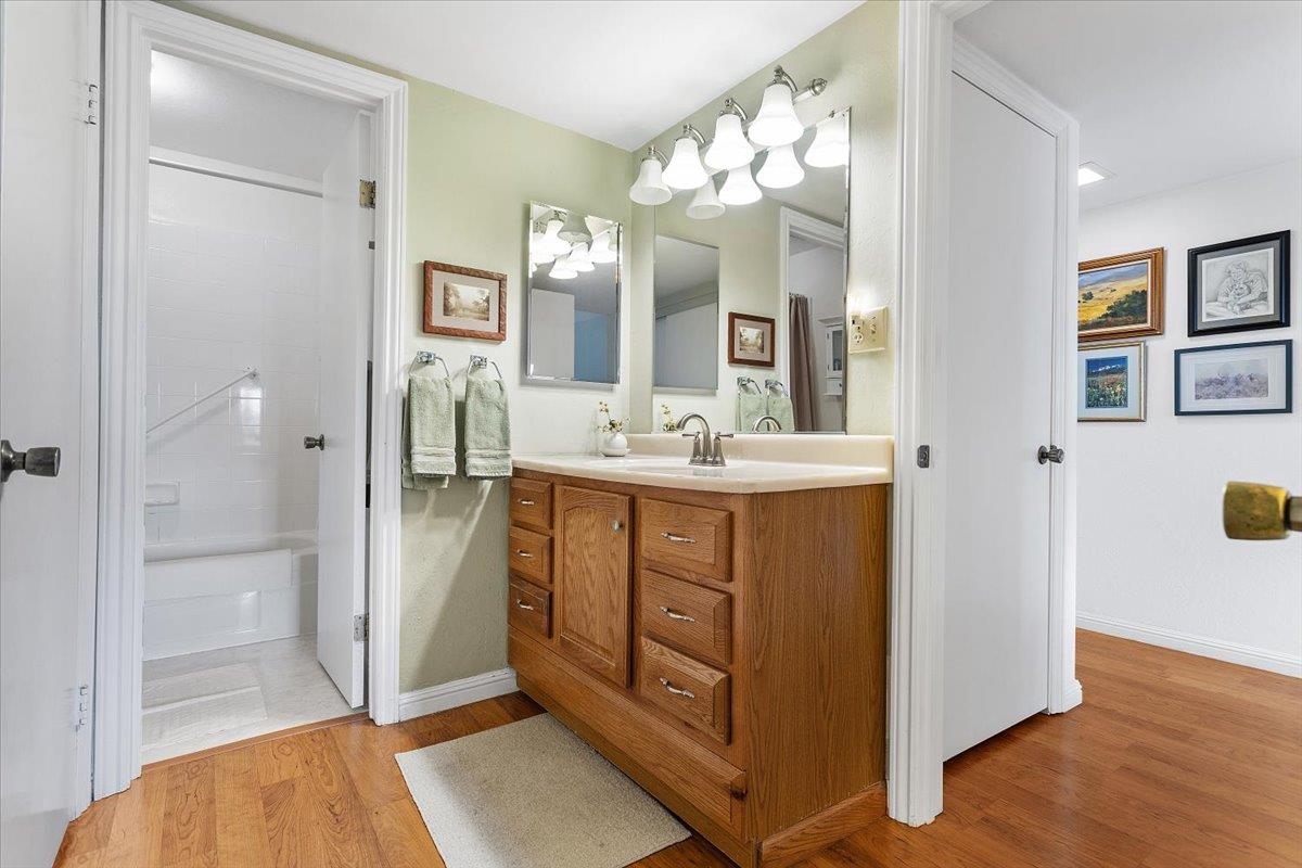 19100 Crest Avenue, Unit 15 Castro Valley, CA 94546 - Photo 18 of 33 a bathroom with a double vanity sink mirror and shower