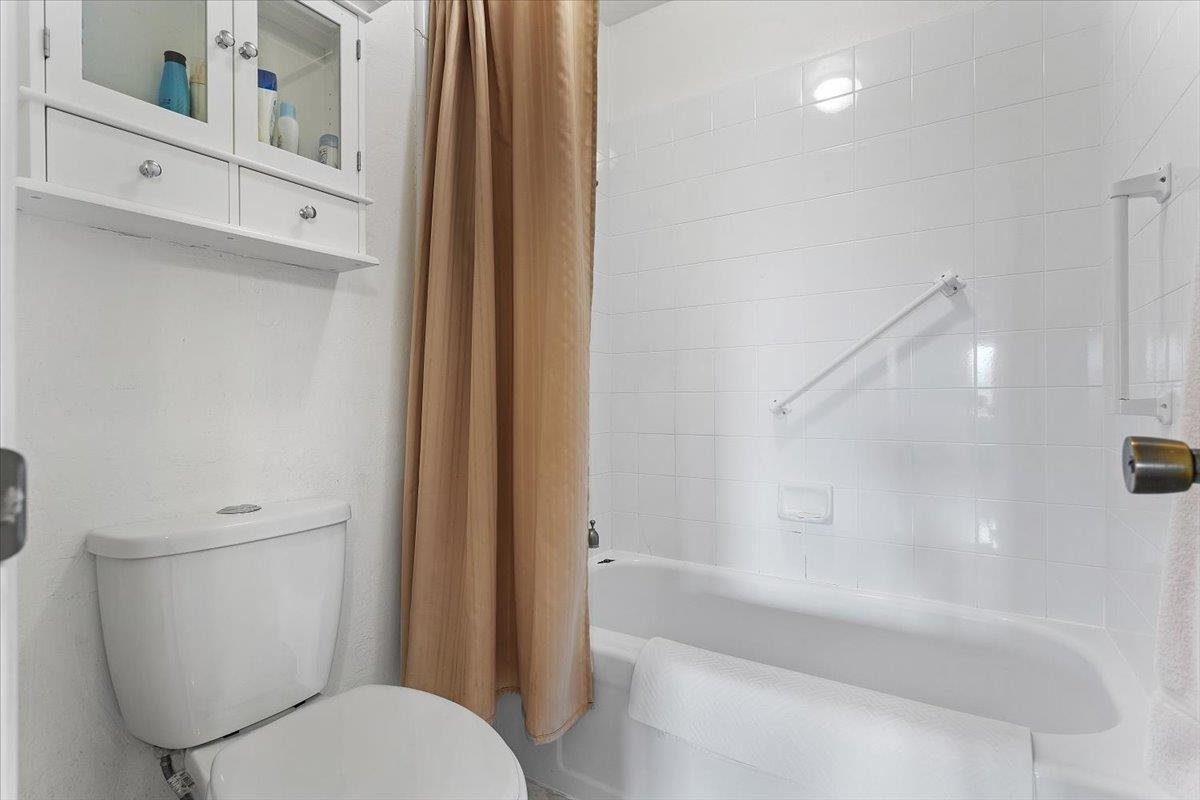 19100 Crest Avenue, Unit 15 Castro Valley, CA 94546 - Photo 19 of 33 a white toilet sitting next to a bath tub