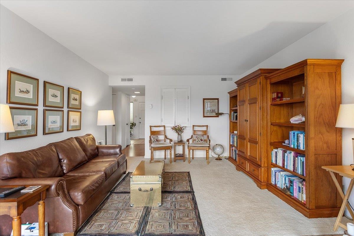 19100 Crest Avenue, Unit 15 Castro Valley, CA 94546 - Photo 9 of 33 a living room with furniture and a book shelf