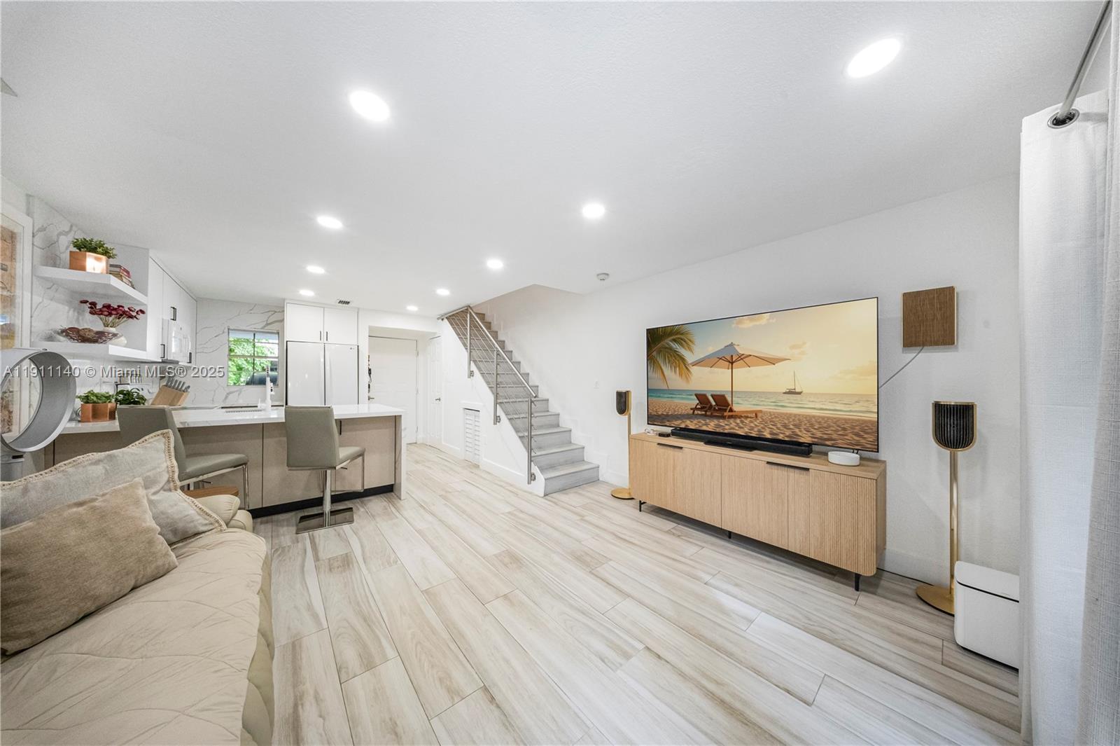 3130 Bird Avenue, Unit 12 Miami, FL 33133 - Photo 13 of 23 a living room with furniture and a wooden floor