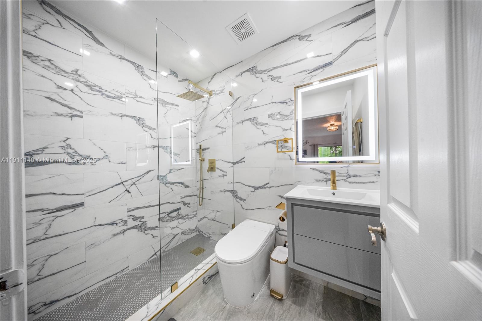 3130 Bird Avenue, Unit 12 Miami, FL 33133 - Photo 18 of 23 a bathroom with a sink toilet and shower