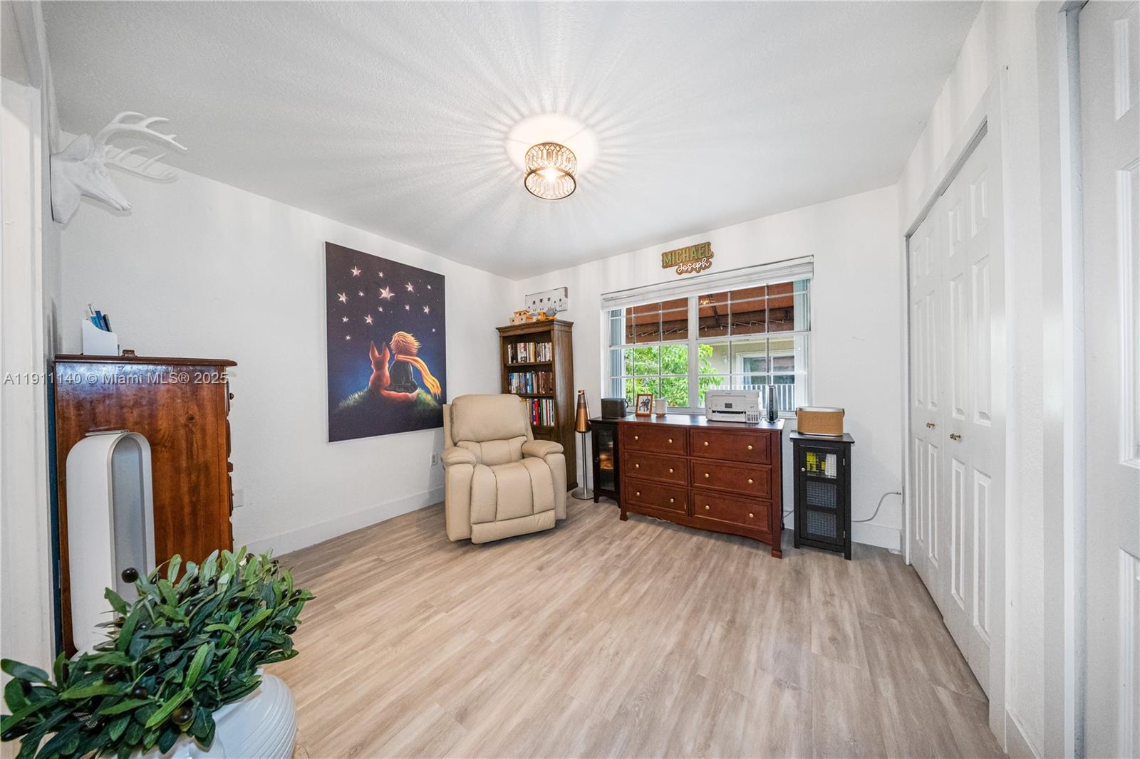 3130 Bird Avenue, Unit 12 Miami, FL 33133 - Photo 19 of 23 a living room with furniture and a large window