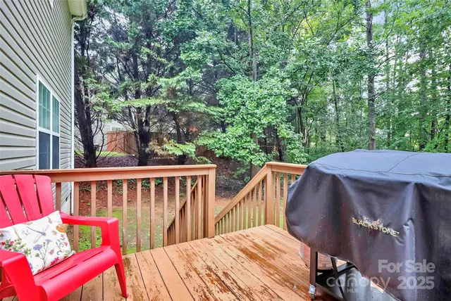a view of balcony with wooden floor and outdoor seating