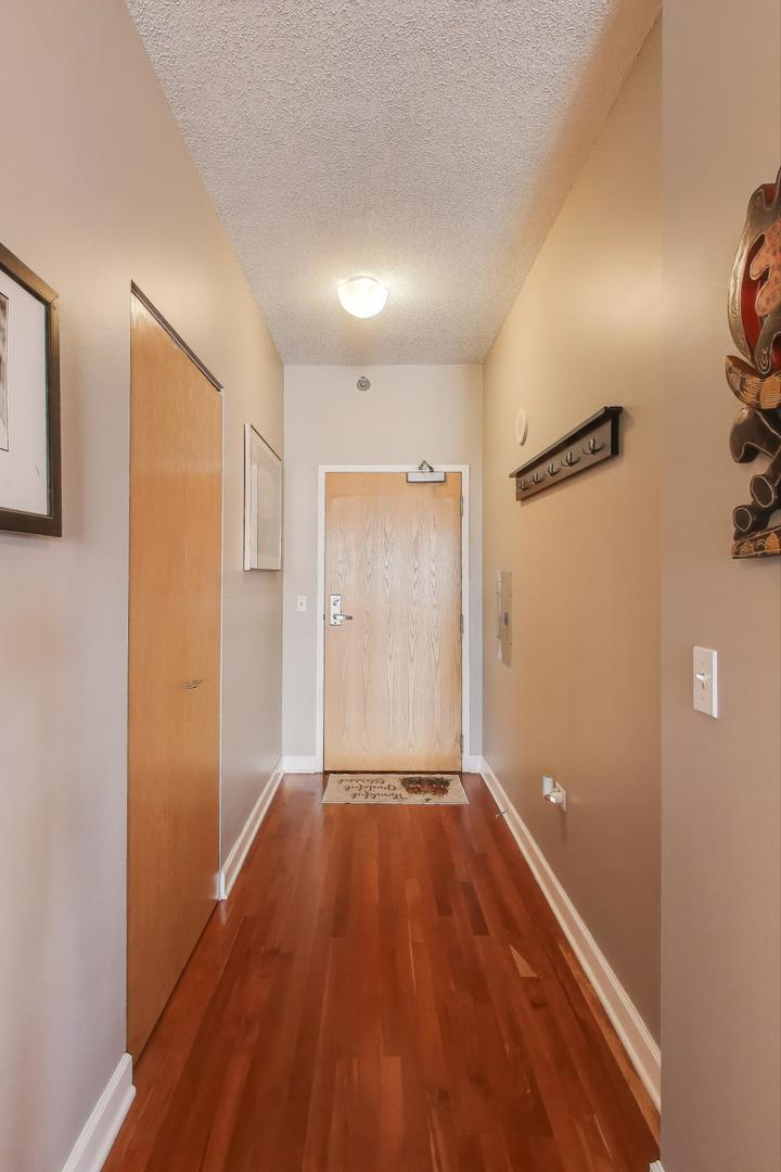 1529 South State Street, Unit 14J Chicago, IL 60605 - Photo 2 of 30 a view of a hallway with wooden floor