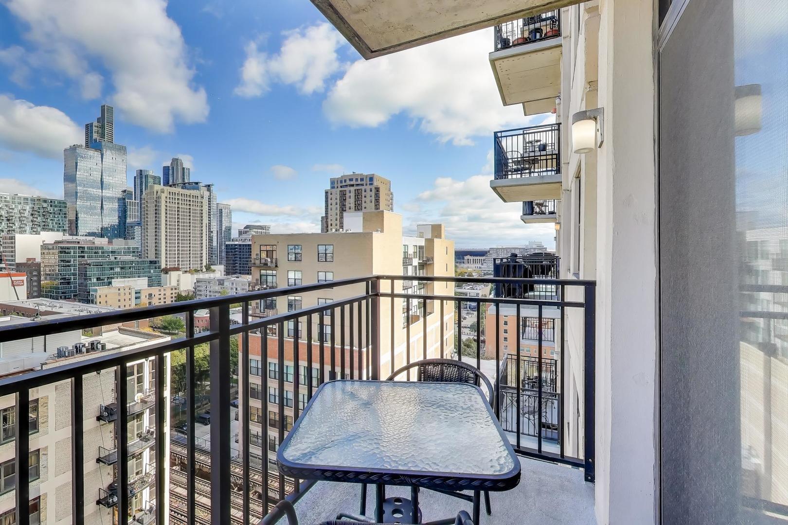 1529 South State Street, Unit 14J Chicago, IL 60605 - Photo 21 of 30 a view of a balcony with wooden floor