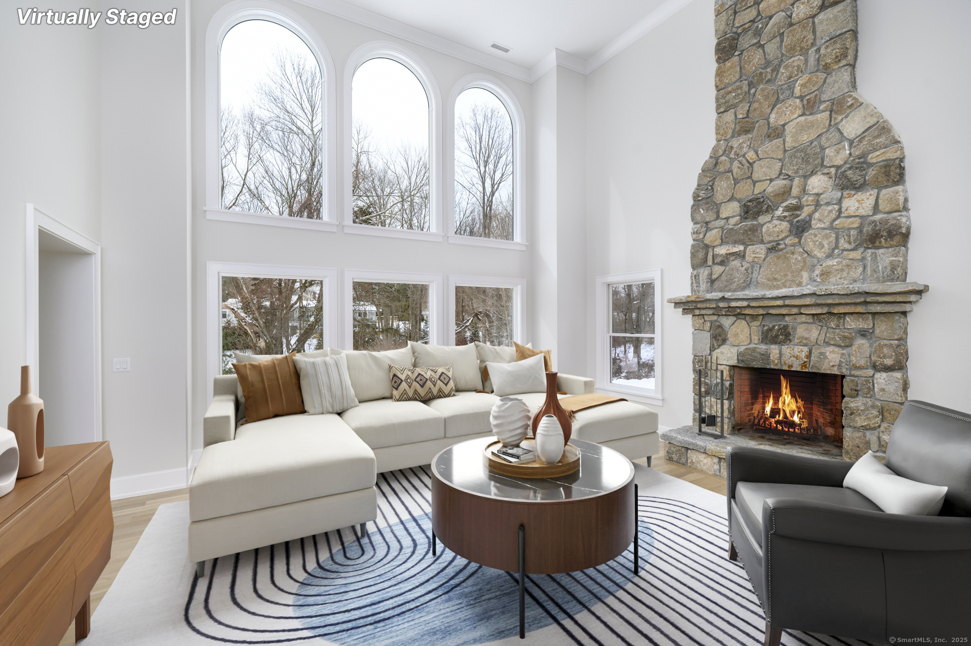 40 Hoyclo Road Stamford, CT 06903 - Photo 16 of 38 a living room with furniture a fireplace and a large mirror