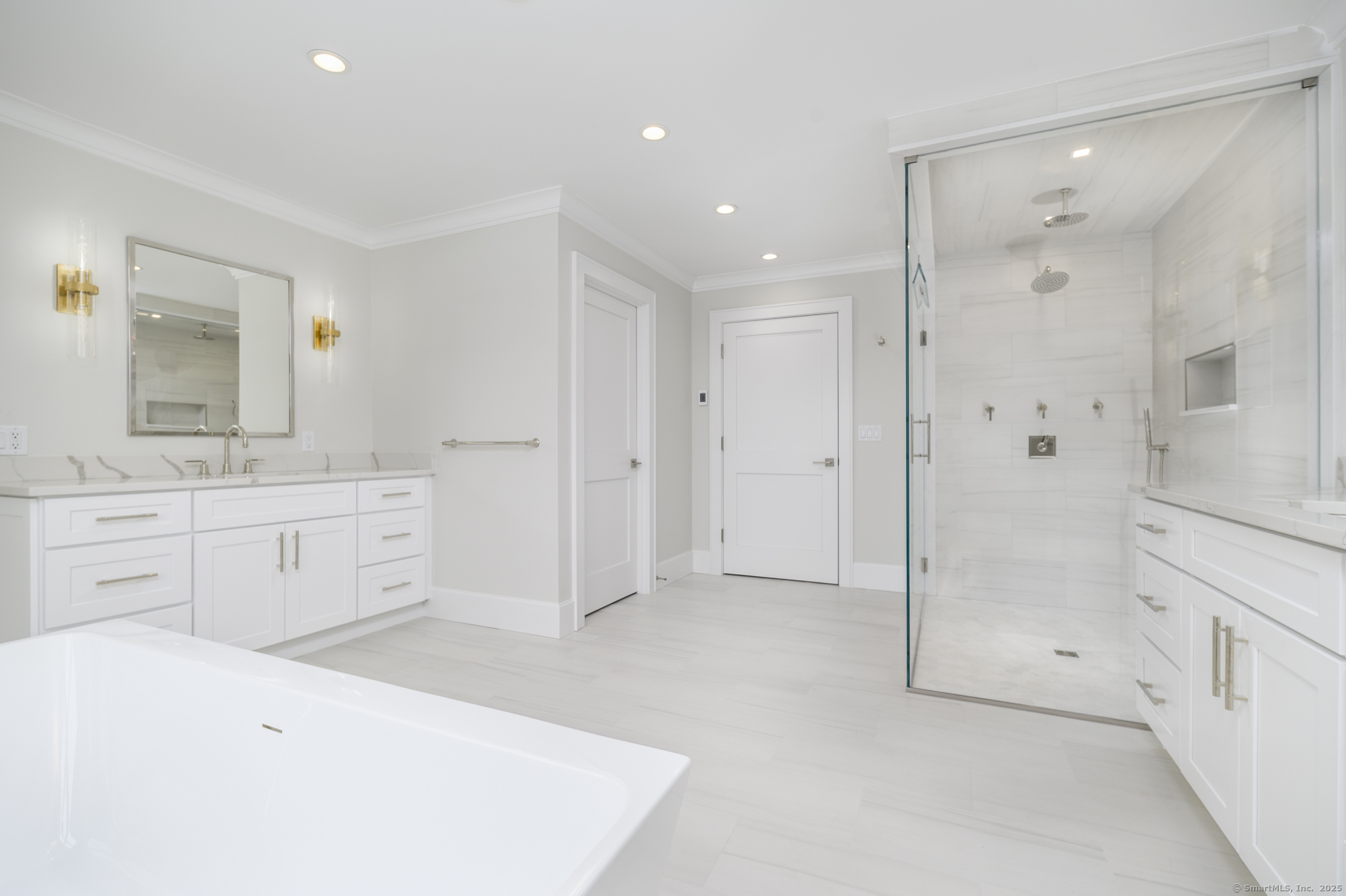 40 Hoyclo Road Stamford, CT 06903 - Photo 26 of 38 a bathroom with a shower sink and a mirror