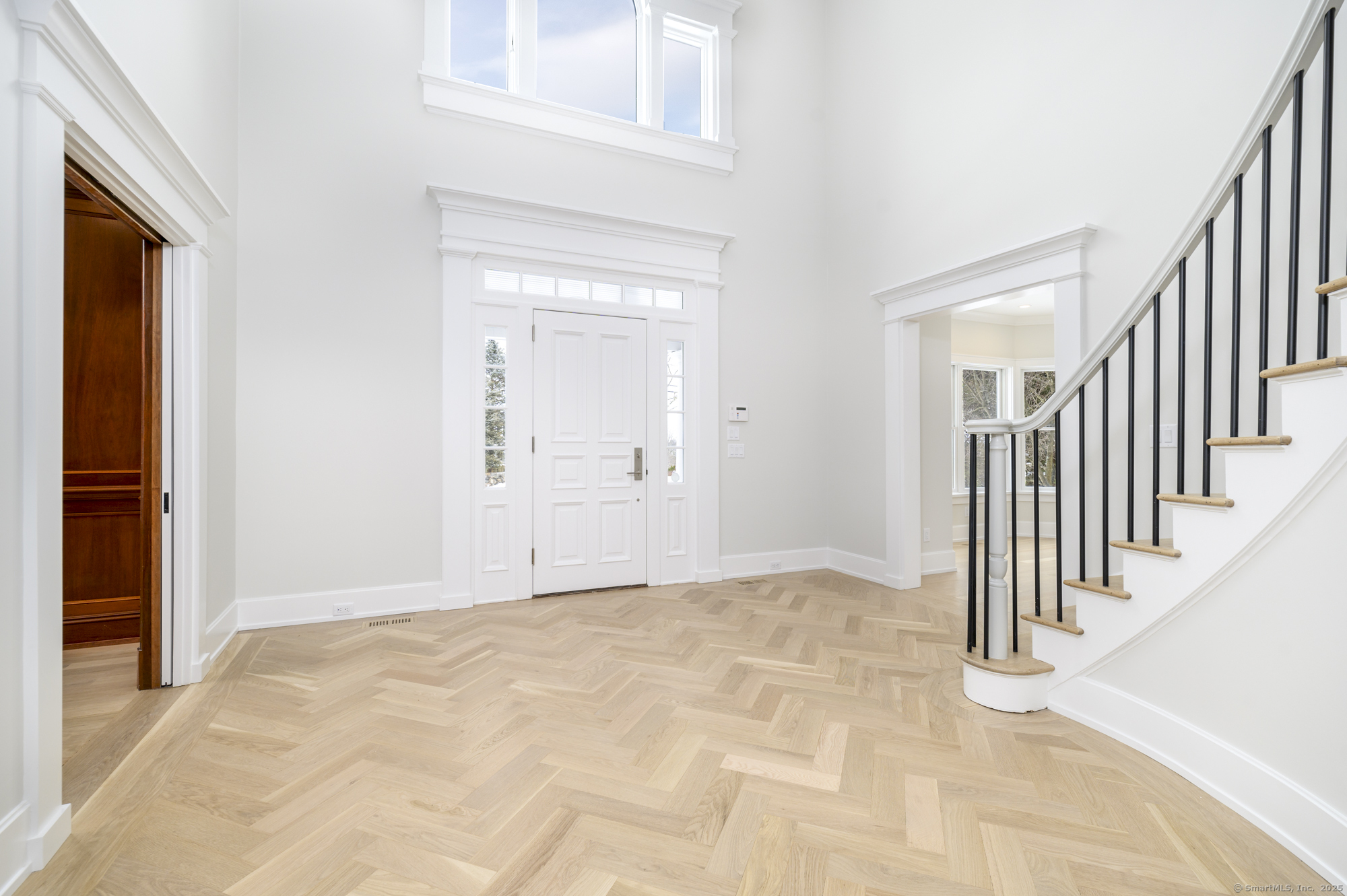 40 Hoyclo Road Stamford, CT 06903 - Photo 5 of 38 a view of a hallway with wooden floor and staircase