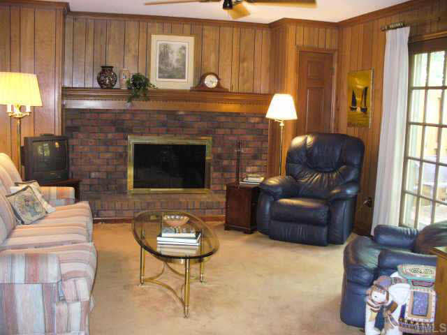 6900 Buckhead Drive Raleigh, NC 27615 - Photo 2 of 10 a living room with furniture and a fireplace