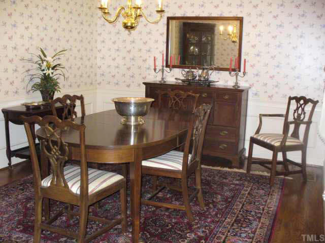 6900 Buckhead Drive Raleigh, NC 27615 - Photo 4 of 10 a view of a dining room with furniture and wooden floor