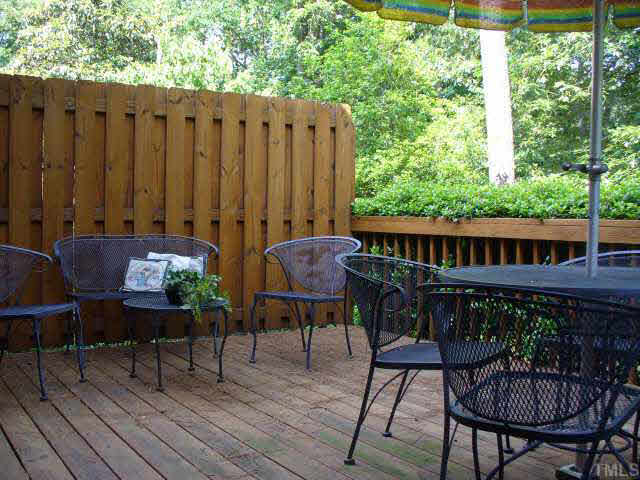 6900 Buckhead Drive Raleigh, NC 27615 - Photo 7 of 10 a view of a chairs and table in the patio with wooden fence