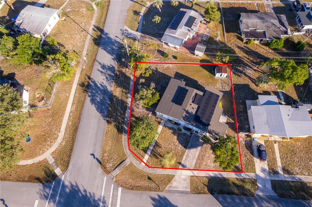 an aerial view of houses with outdoor space