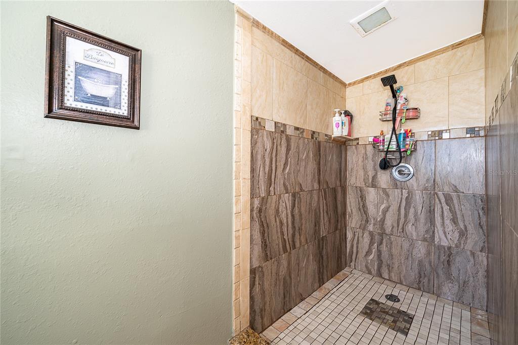 944 Halstead Street Deltona, FL 32725 - Photo 12 of 28 a bathroom with a shower and a sink