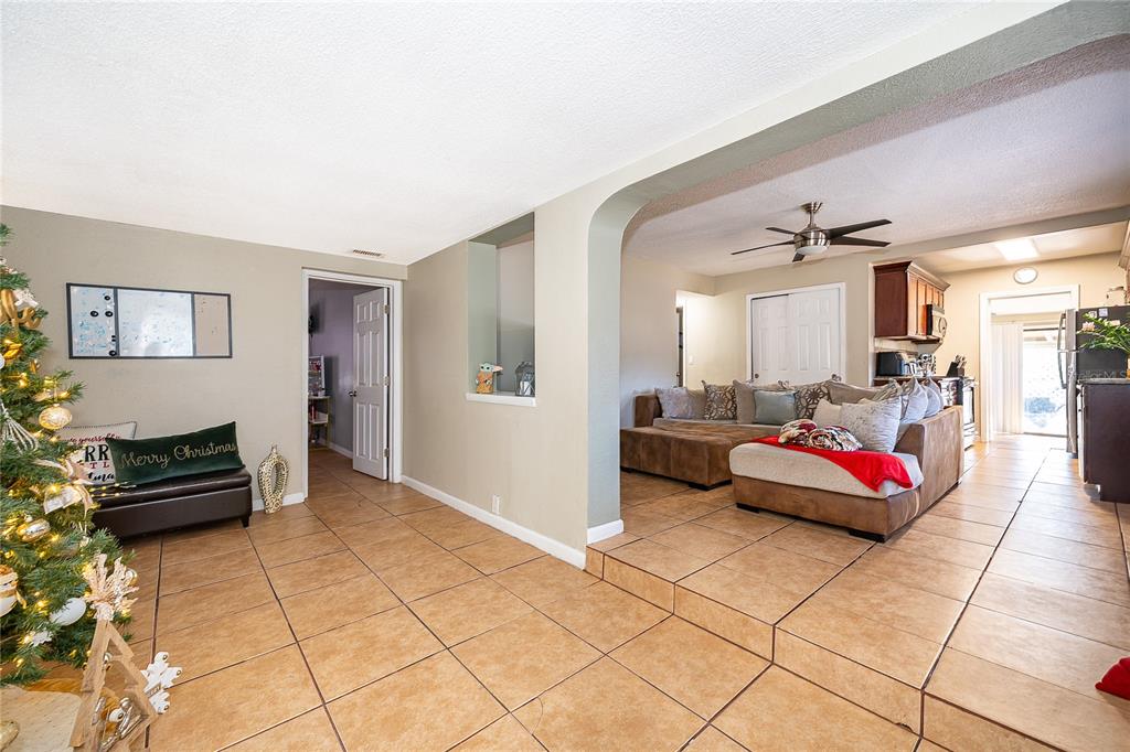 944 Halstead Street Deltona, FL 32725 - Photo 20 of 28 a living room with furniture and a rug