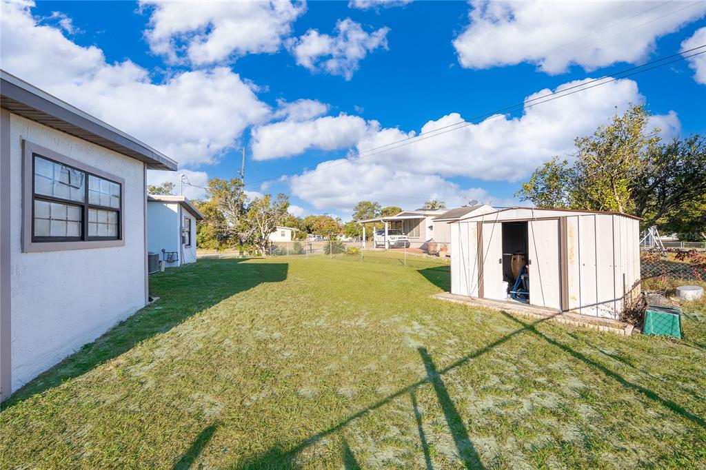 944 Halstead Street Deltona, FL 32725 - Photo 27 of 28 a view of a backyard of the house