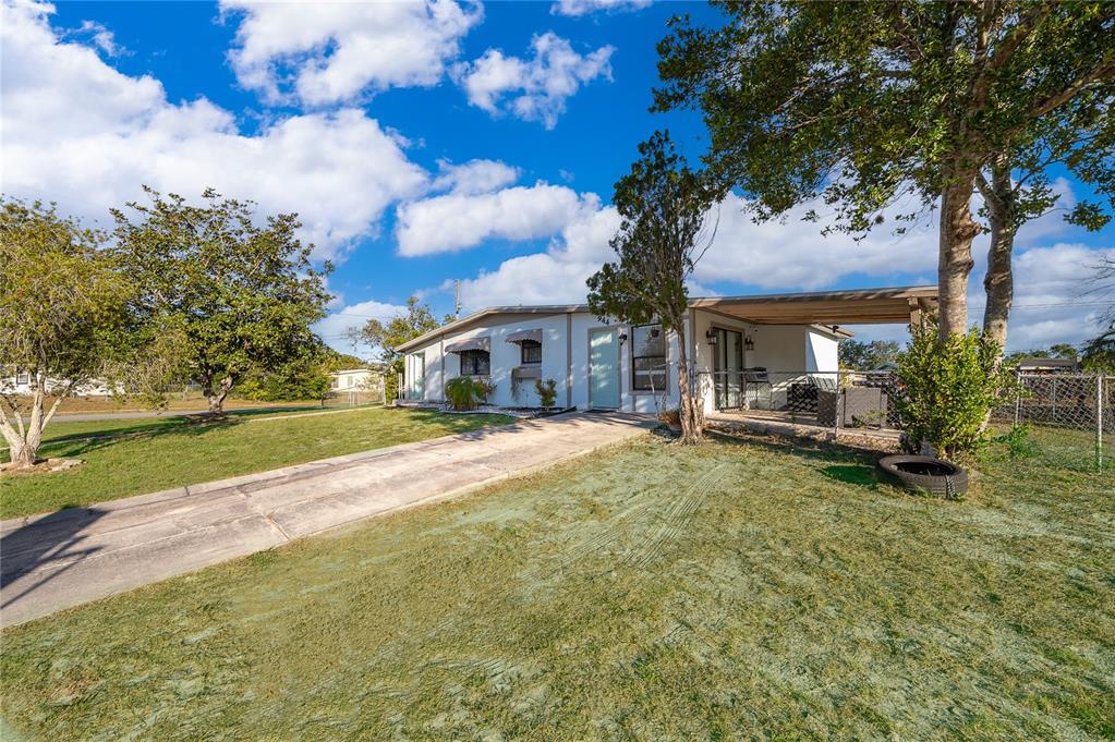 944 Halstead Street Deltona, FL 32725 - Photo 4 of 28 a view of house with yard and green space