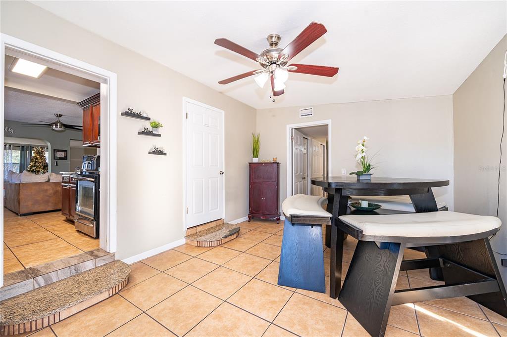 944 Halstead Street Deltona, FL 32725 - Photo 9 of 28 a view of a workspace with furniture