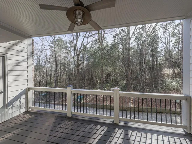 a view of a two chairs in the balcony