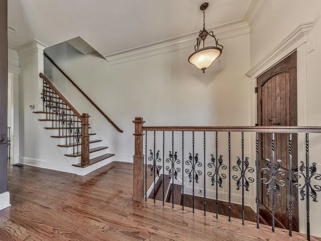 a view of entryway and hall with wooden floor