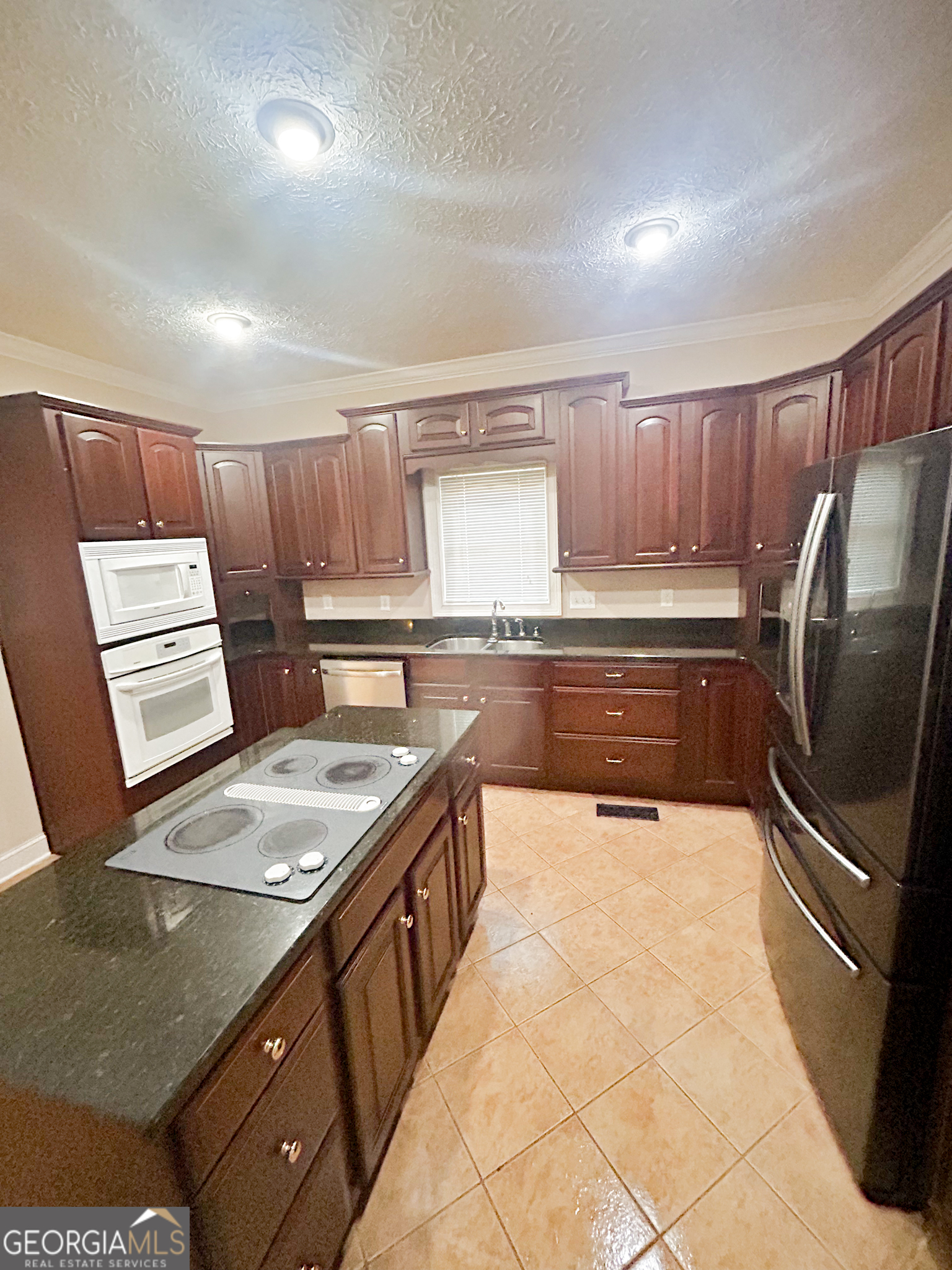 1136 Cole Lake Road Dallas, GA 30157 - Photo 14 of 57 a kitchen with stainless steel appliances granite countertop a sink stove and refrigerator