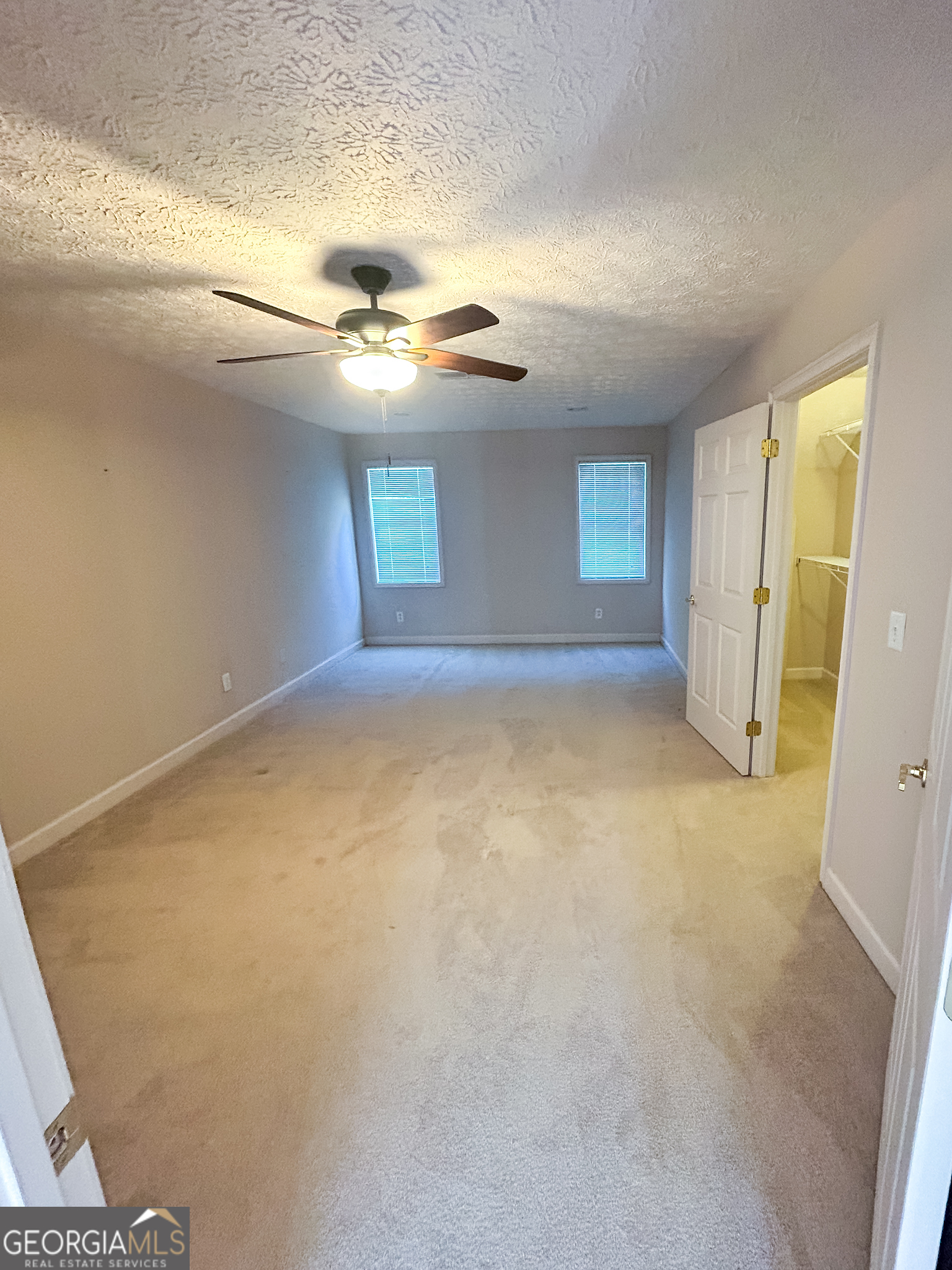 1136 Cole Lake Road Dallas, GA 30157 - Photo 39 of 57 an empty room with windows and cabinet