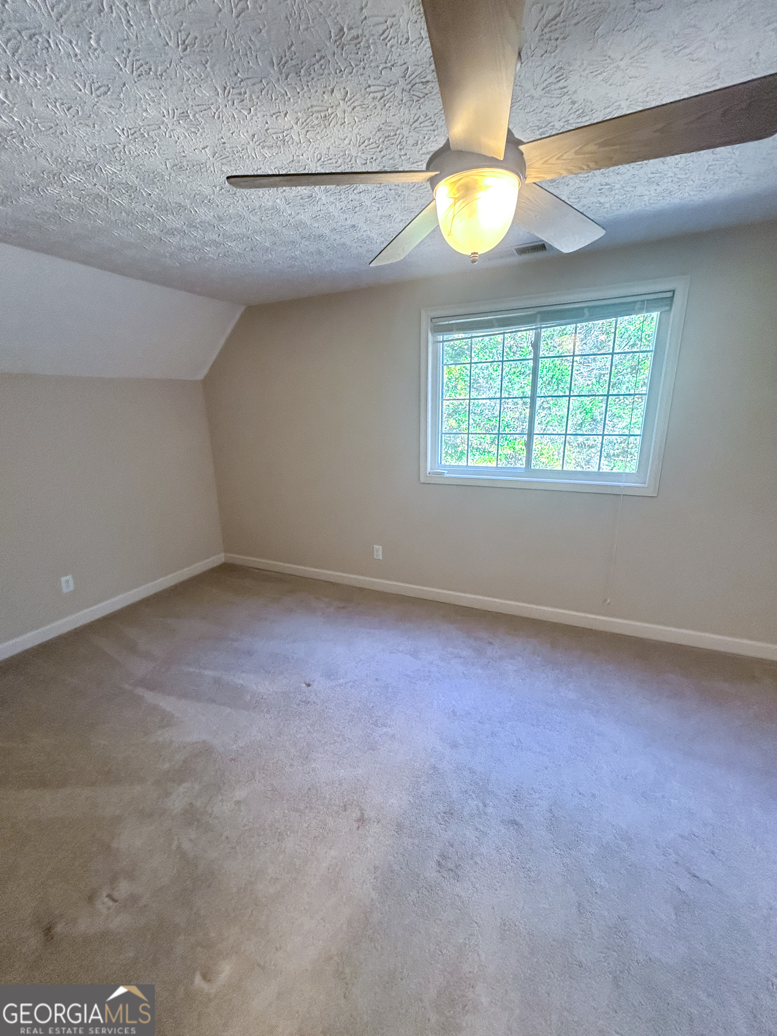 1136 Cole Lake Road Dallas, GA 30157 - Photo 41 of 57 an empty room with a window and fireplace