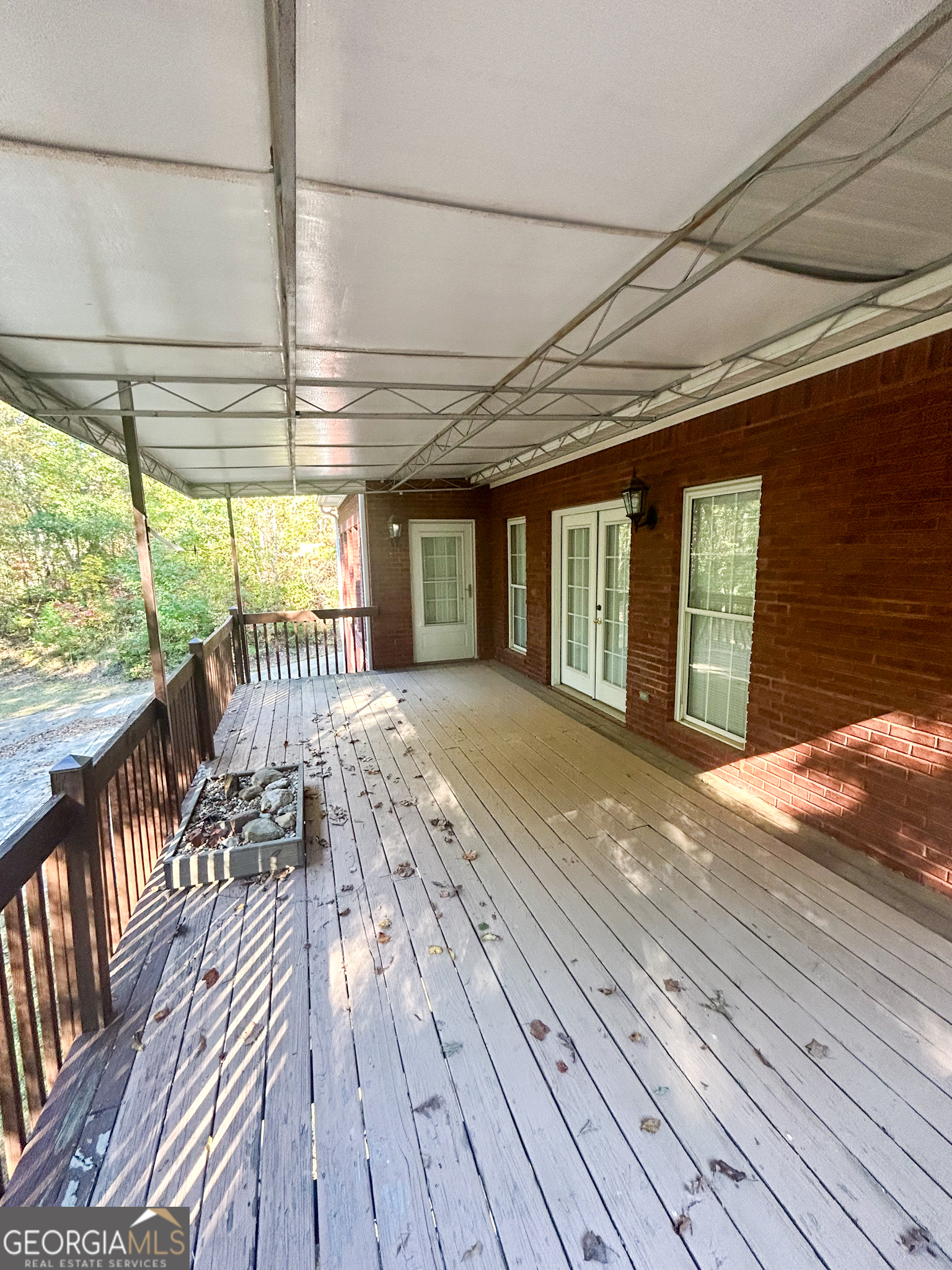 1136 Cole Lake Road Dallas, GA 30157 - Photo 6 of 57 a view of a balcony with wooden floor