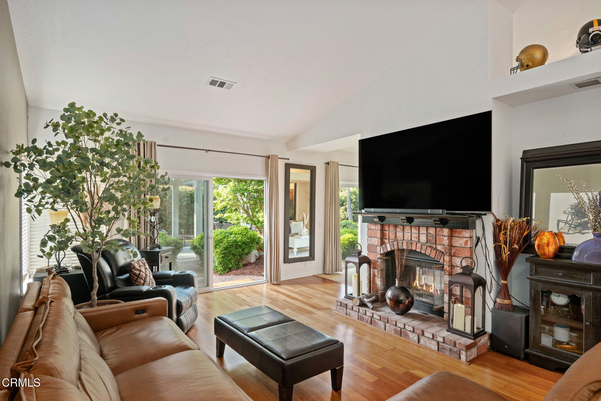 1501 Devonshire Drive Oxnard, CA 93030 - Photo 11 of 39 a living room with furniture a flat screen tv and a fireplace