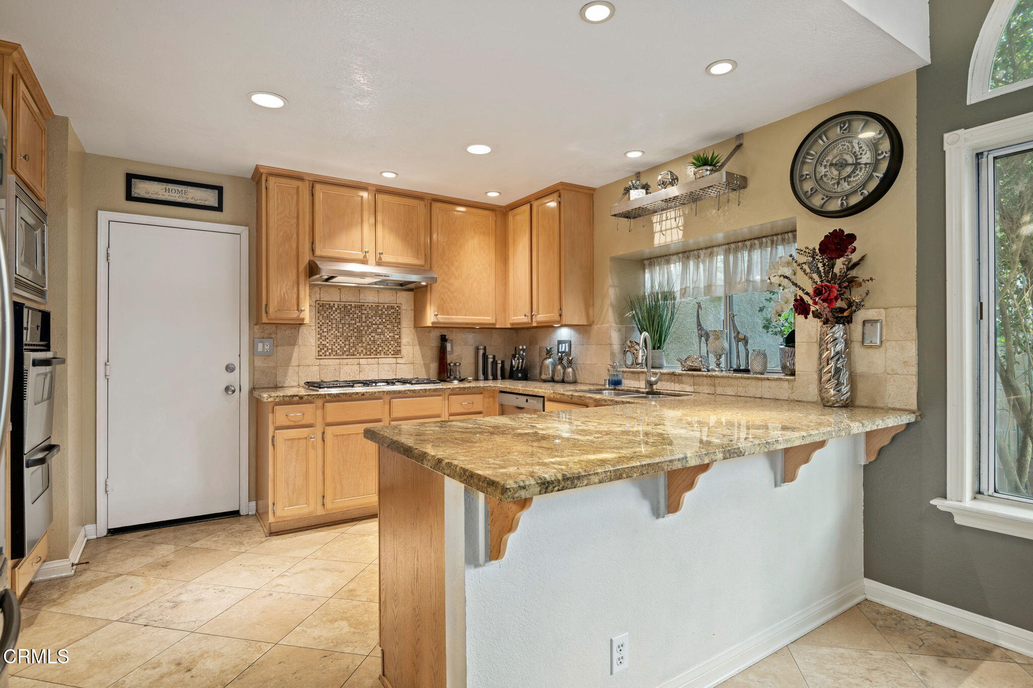 1501 Devonshire Drive Oxnard, CA 93030 - Photo 15 of 39 a kitchen with stainless steel appliances granite countertop a sink a stove and a refrigerator