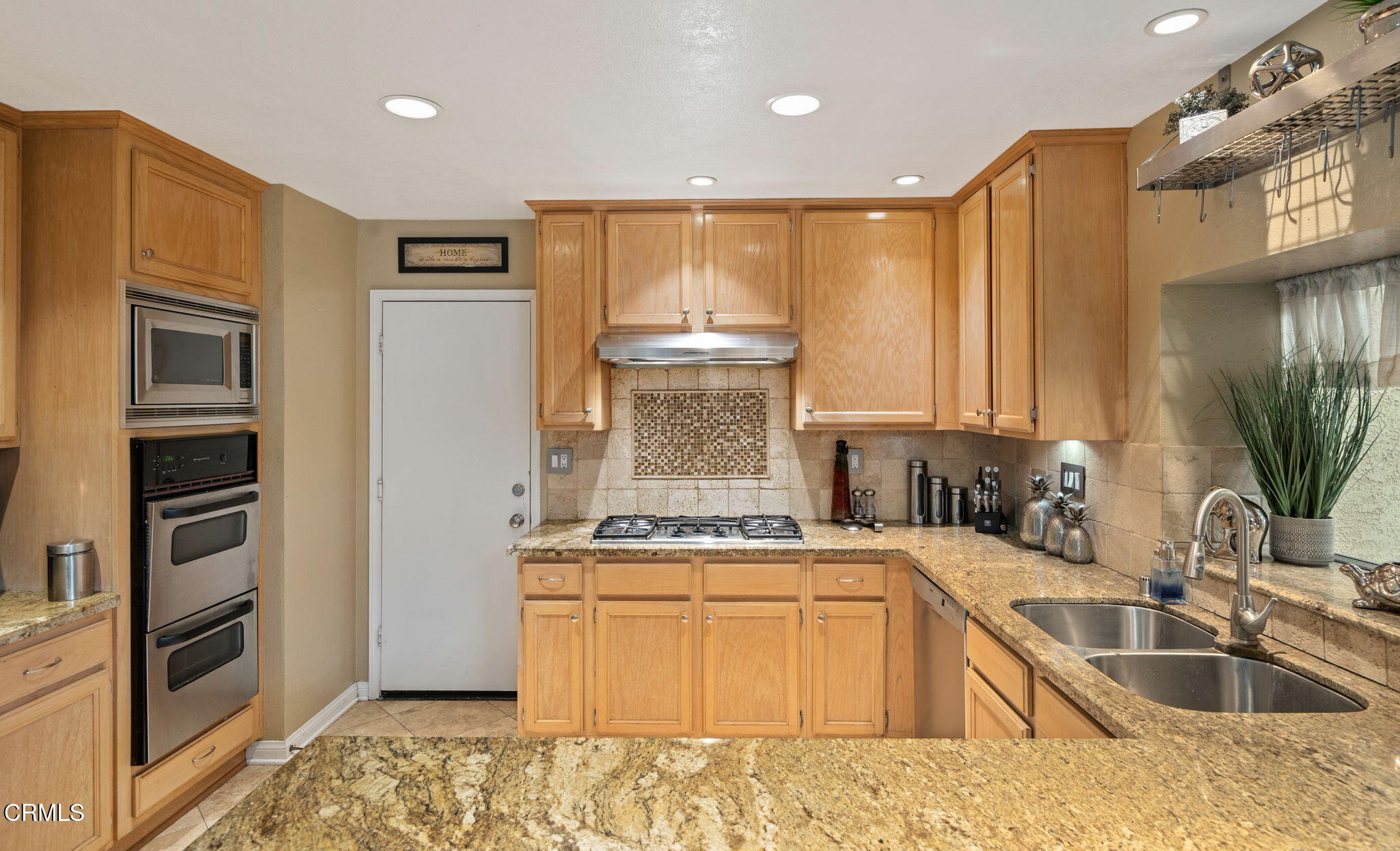 1501 Devonshire Drive Oxnard, CA 93030 - Photo 16 of 39 a kitchen with stainless steel appliances granite countertop a sink stove and refrigerator