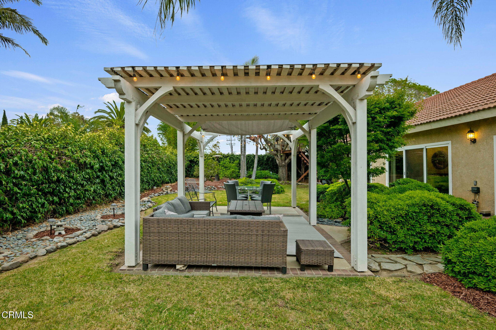 1501 Devonshire Drive Oxnard, CA 93030 - Photo 28 of 39 a view of a patio with table and chairs potted plants with palm trees