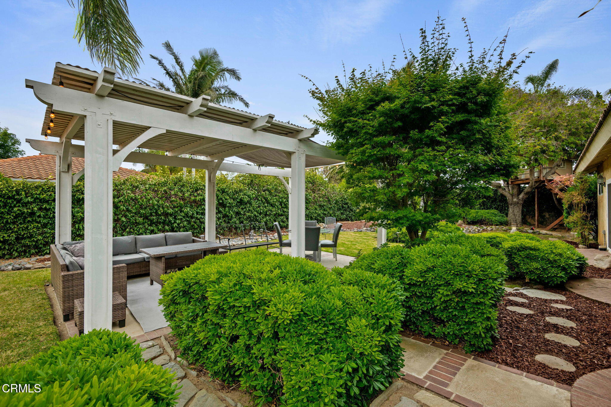 1501 Devonshire Drive Oxnard, CA 93030 - Photo 29 of 39 a view of a house with a yard and a garden