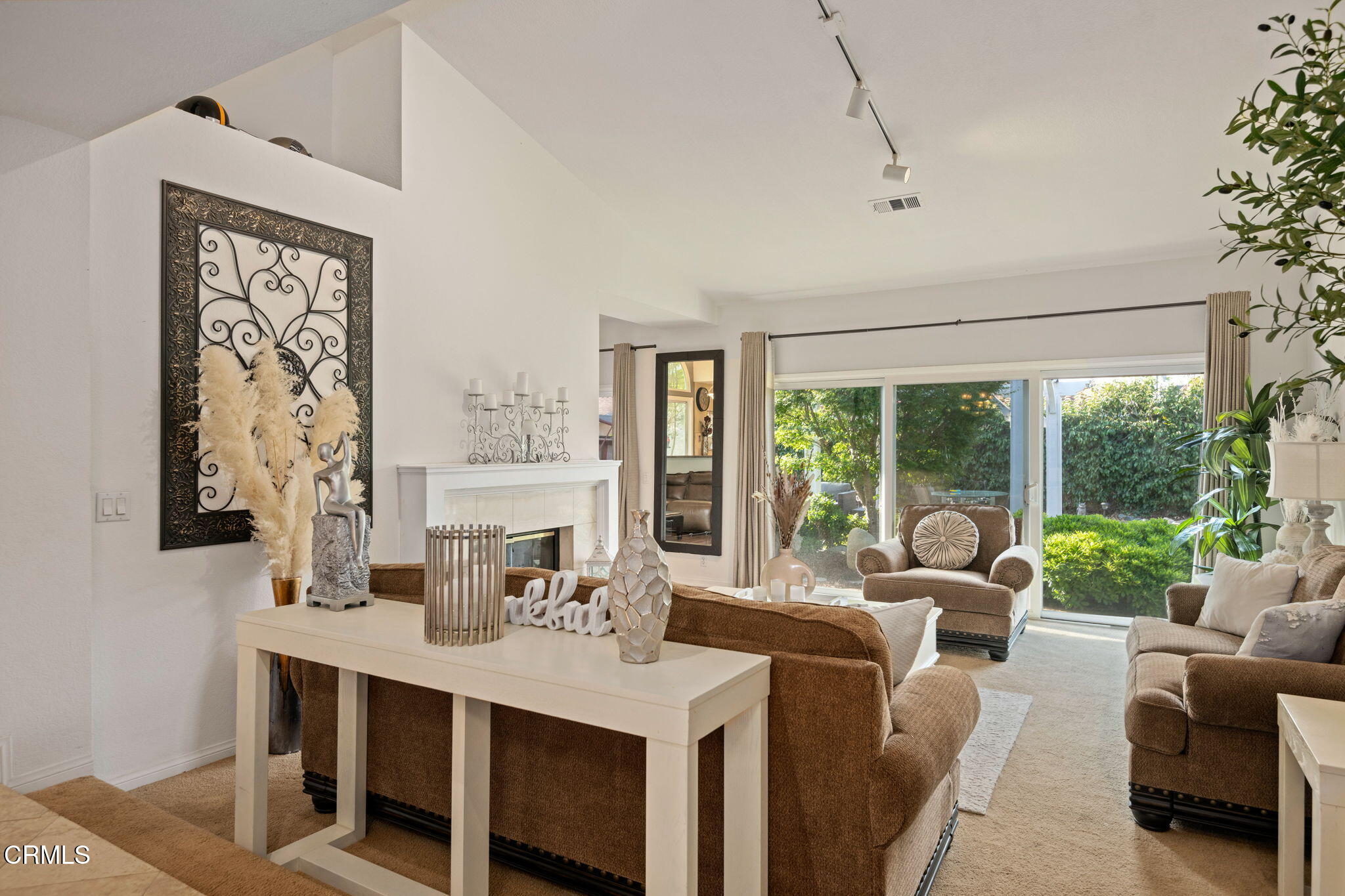1501 Devonshire Drive Oxnard, CA 93030 - Photo 3 of 39 a living room with furniture large windows plants and kitchen view