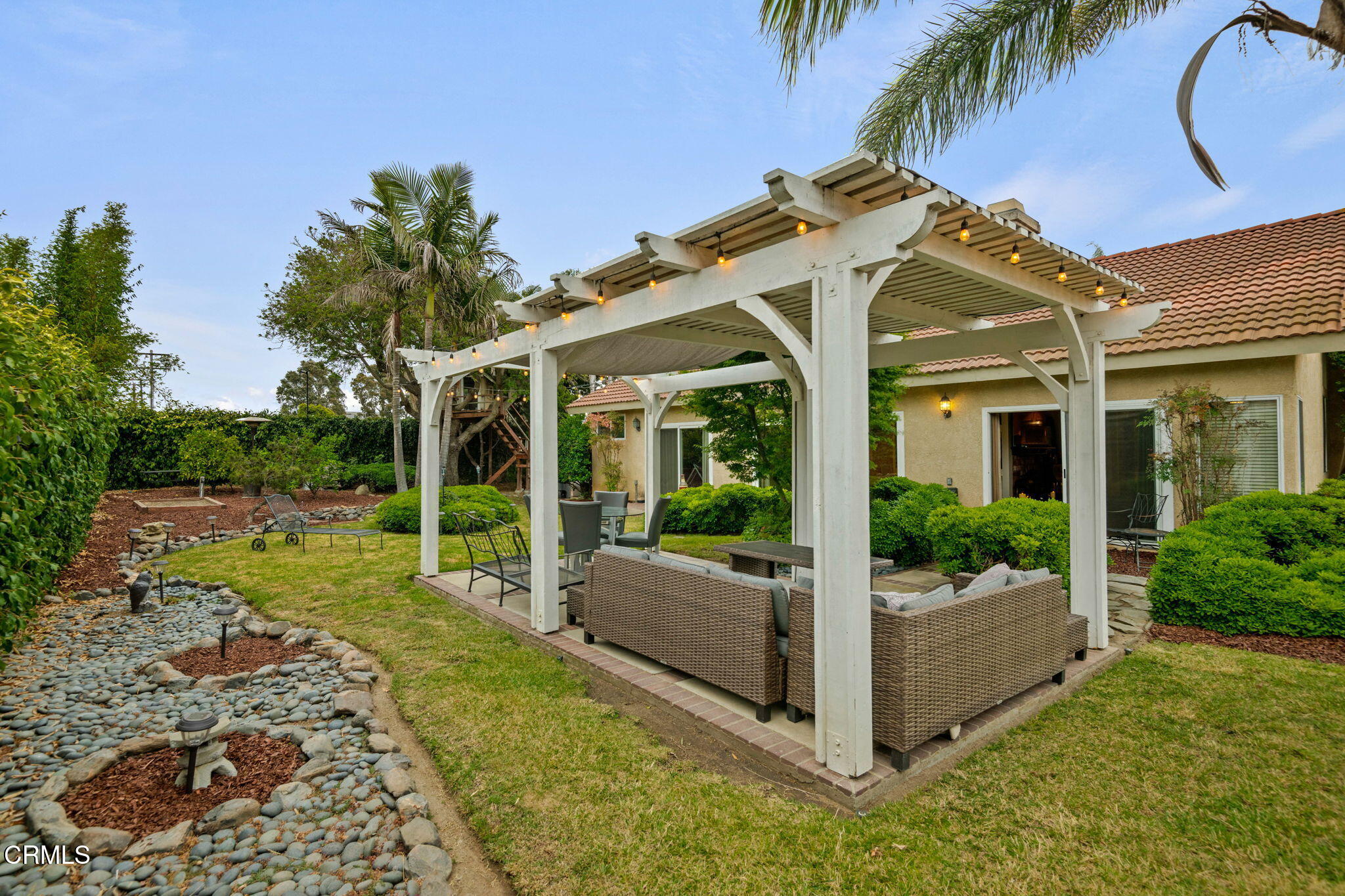 1501 Devonshire Drive Oxnard, CA 93030 - Photo 31 of 39 a view of a white house with a big yard and potted plants