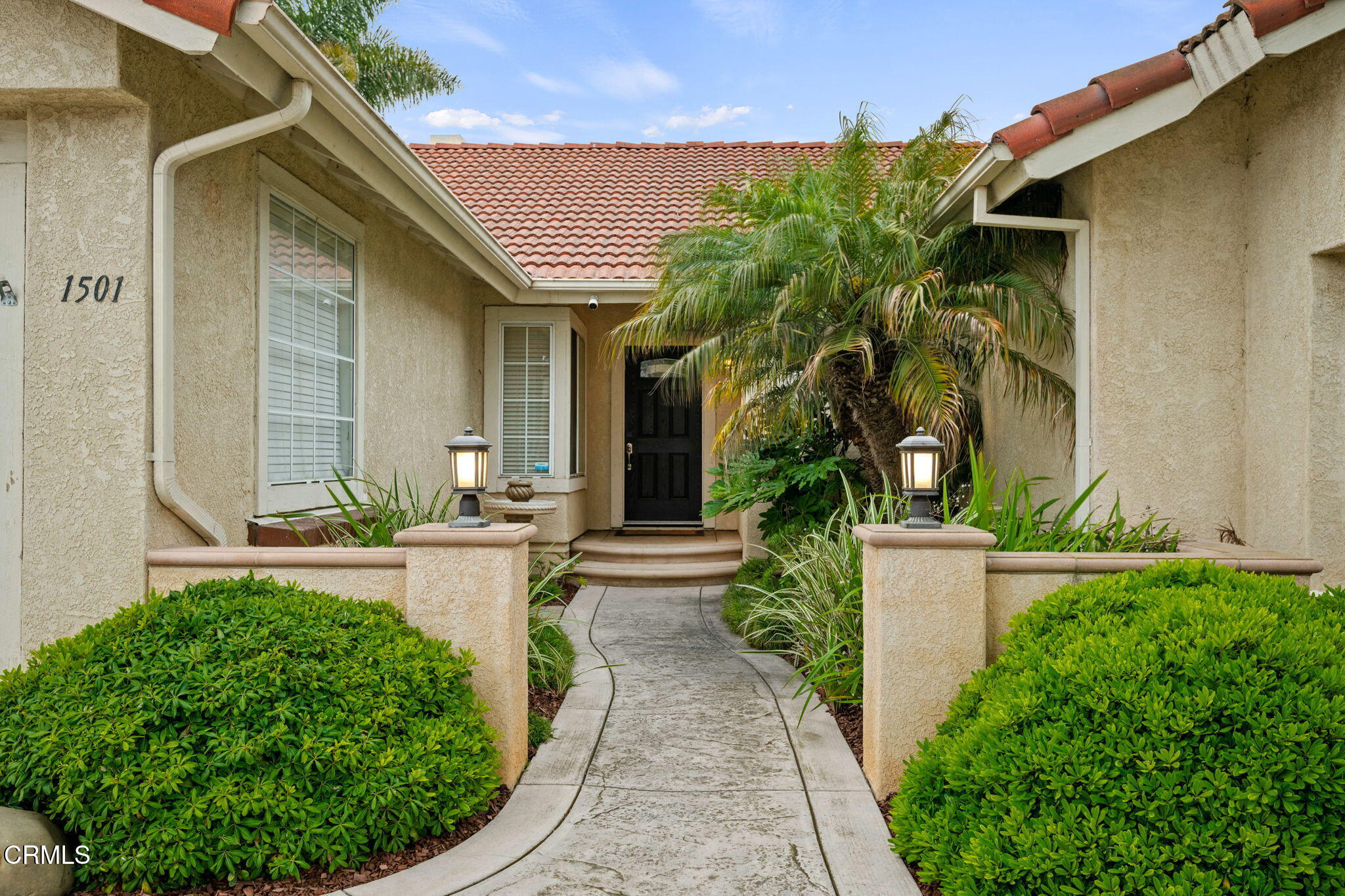 1501 Devonshire Drive Oxnard, CA 93030 - Photo 6 of 39 a view of a house with a small yard plants and large tree