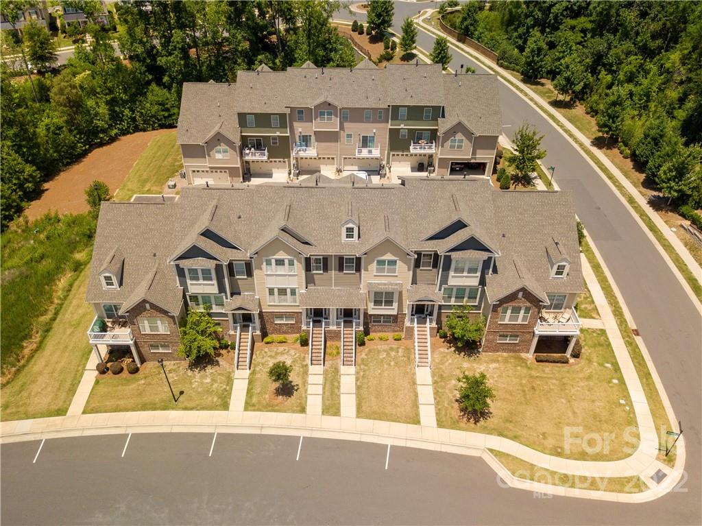208 Butterfly Place Tega Cay, SC 29708 - Photo 3 of 30 an aerial view of a house with a swimming pool