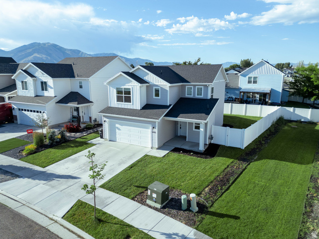 1486 West 2055th Street South Logan, UT 84339 - Photo 34 of 45 Modern two-story residence featuring light gray siding and dark shingle roofing