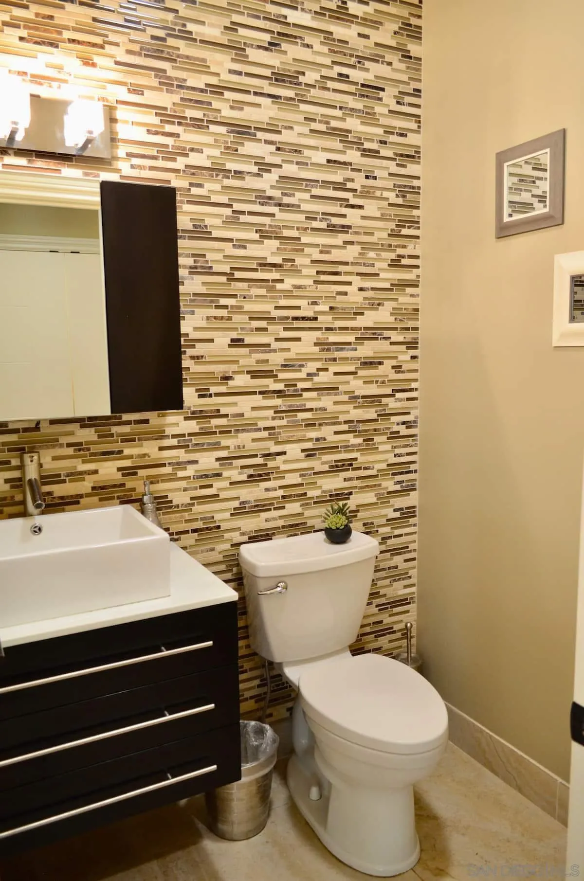 1235 Neptune Avenue Encinitas, CA 92024 - Photo 7 of 32 a bathroom with a toilet and a sink