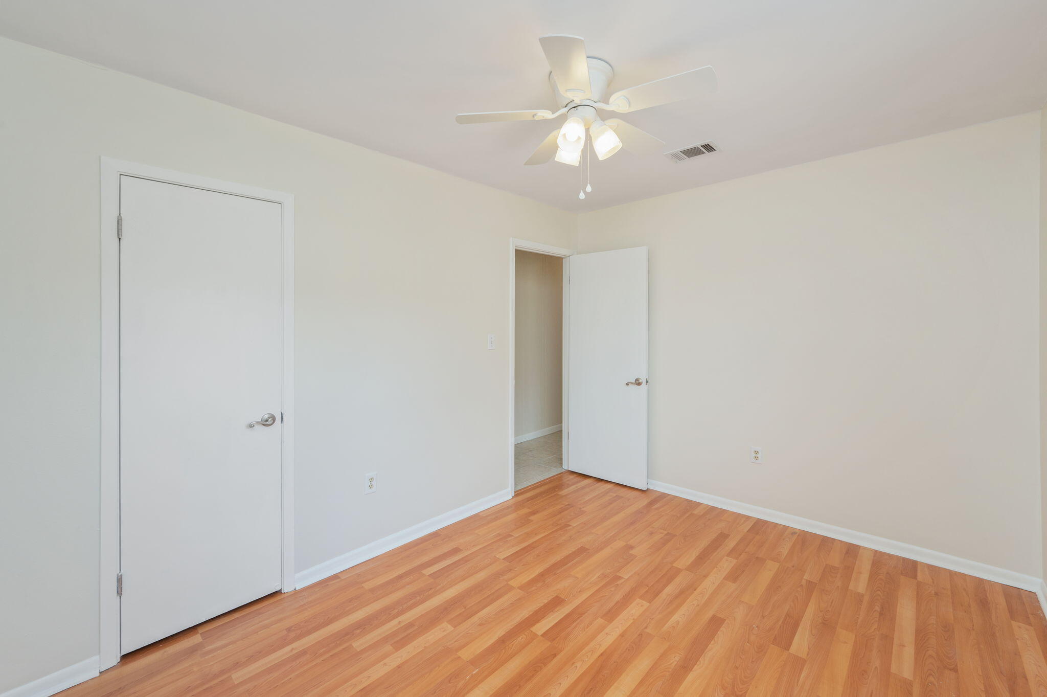 5356 Constitution Road Crestview, FL 32539 - Photo 18 of 32 a view of empty room with wooden floor