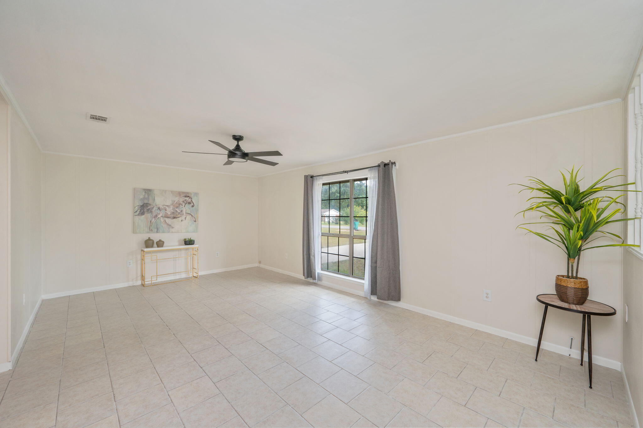 5356 Constitution Road Crestview, FL 32539 - Photo 8 of 32 a view of a livingroom with a potted plant