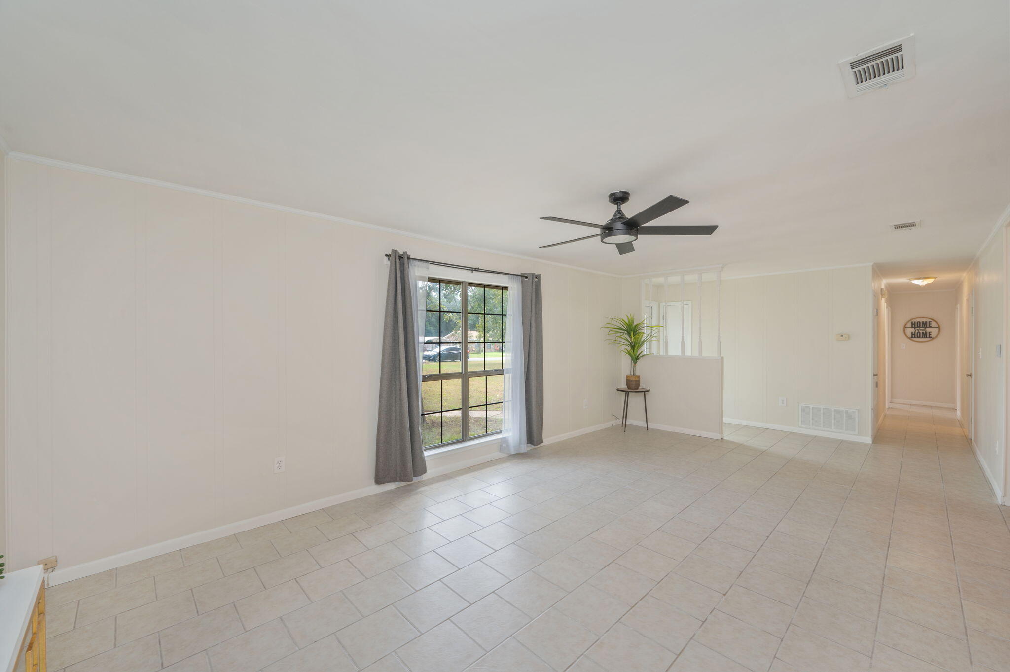 5356 Constitution Road Crestview, FL 32539 - Photo 9 of 32 a view of an empty room with a window