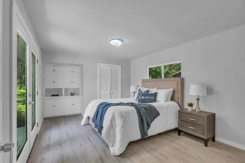 110 North Hillside Street Red Oak, TX 75154 - Photo 13 of 25 Bedroom with light wood-style floors and a closet