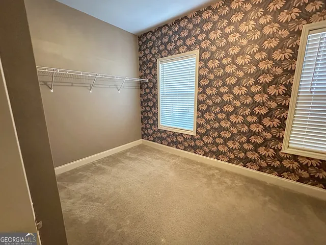 an empty room with windows