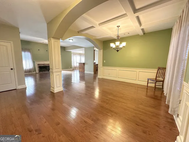 a view of a living room with hardwood floor