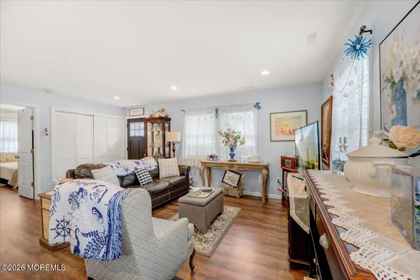 a living room with furniture window and wooden floor