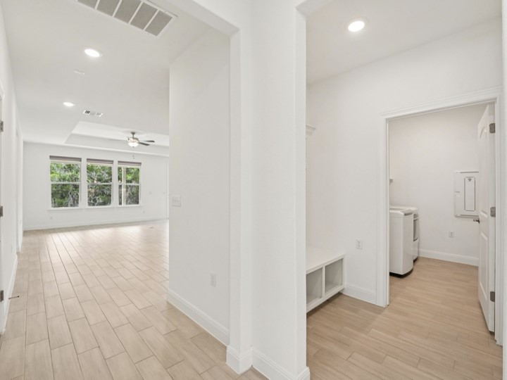 312 Kitty Hawk Road Georgetown, TX 78633 - Photo 14 of 37 a view of an empty room with a window and wooden floor