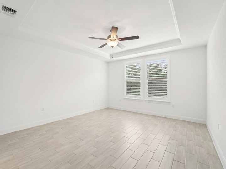 312 Kitty Hawk Road Georgetown, TX 78633 - Photo 16 of 37 an empty room with chandelier fan and windows